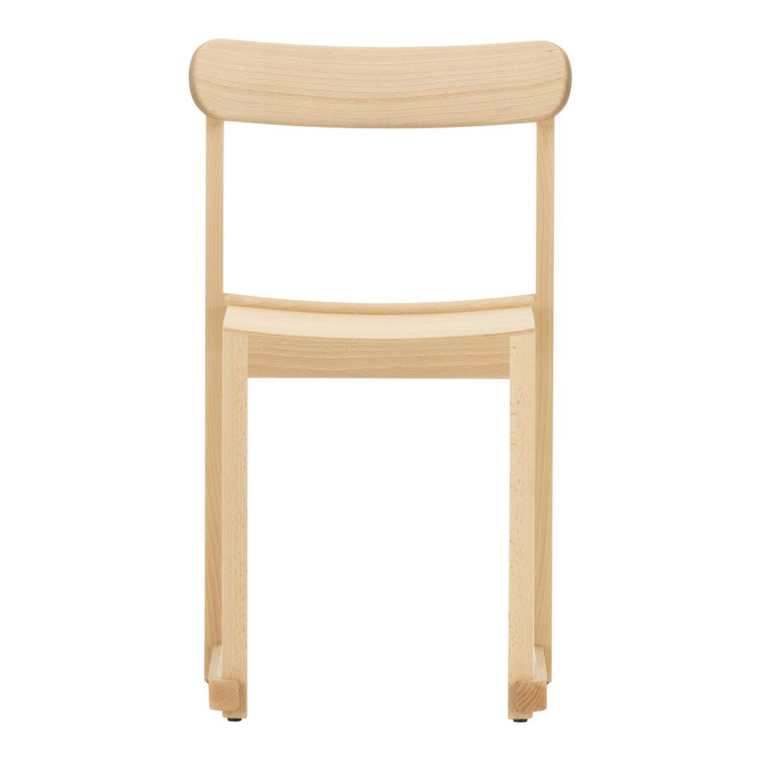 Light natural wood chair with a smooth, minimalist design and curved backrest, showcasing a simple, elegant finish.