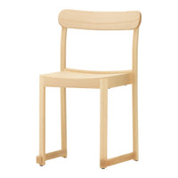 Natural wood chair with a light, minimalist design and smooth, unblemished finish. Ideal for modern interiors.