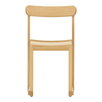 Light natural wood chair with a sleek, minimalist design and smooth finish. Simple and elegant aesthetic.