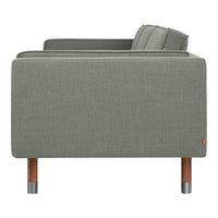 Light grey fabric sofa with simple texture and wooden legs, showcasing a modern minimalist design.