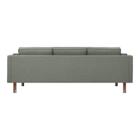 Modern green fabric sofa with a sleek design and wooden legs, featuring a minimalist aesthetic.
