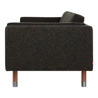 Dark olive green sofa with a subtle textured pattern and natural wood legs. Perfect for modern decor.