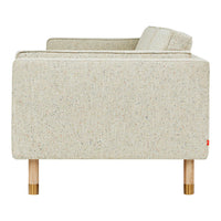 Light beige couch with textured fabric and subtle multicolor flecks, featuring wooden legs. Perfect for modern decor.