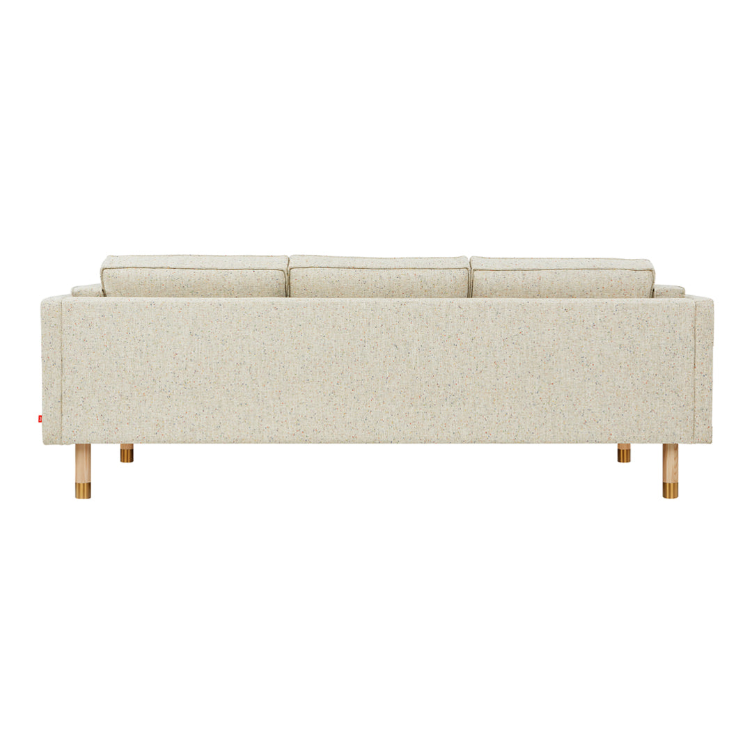 Beige fabric sofa with a minimalist design and subtle texture, featuring wooden legs and a sleek, modern silhouette.