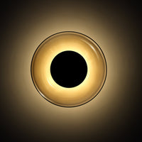 Round LED ceiling light with a glossy gold outer ring and a central black circle, creating a modern minimalist look.