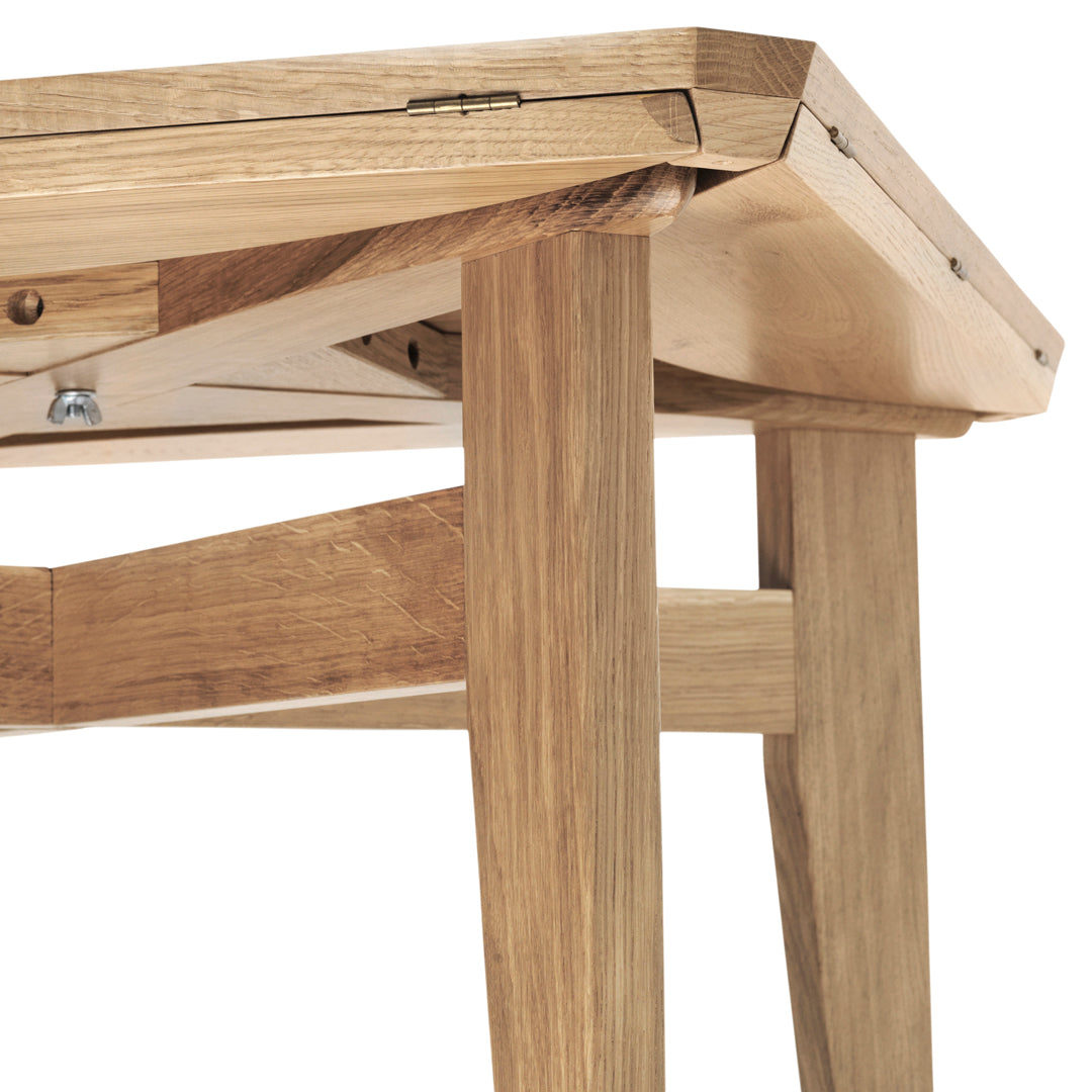 Natural wood table with warm oak tones and a smooth finish, showcasing minimalist design and clean lines.