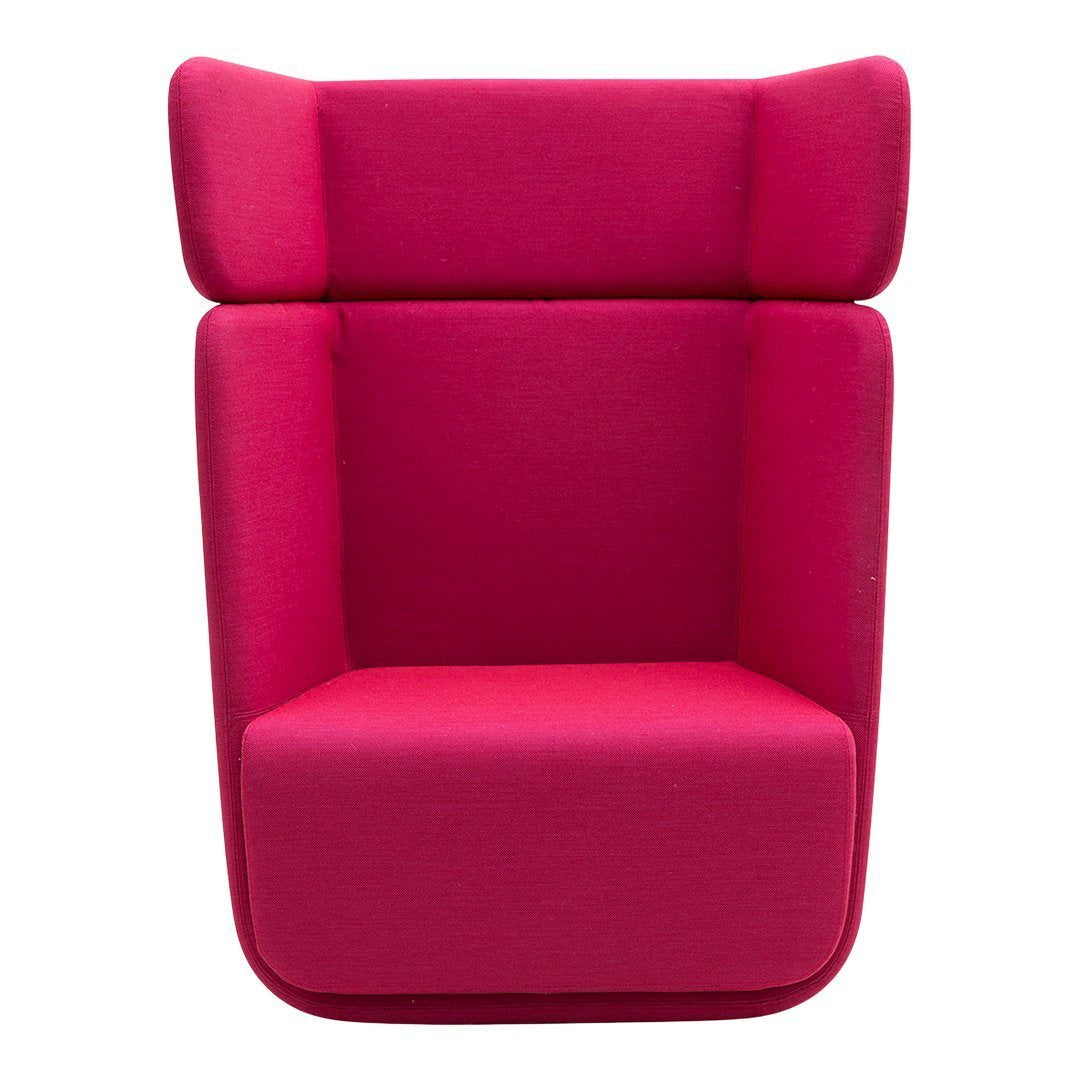 Bright pink upholstered chair with a sleek, modern design and smooth, minimalist lines. Perfect for contemporary decor.