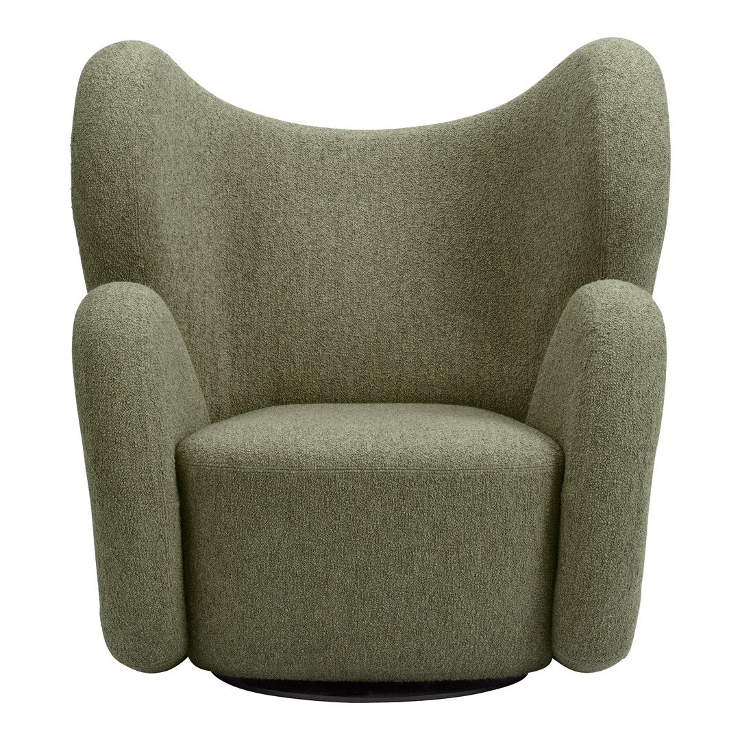 Textured green upholstered armchair with a unique, sculptural design and rounded contours.
