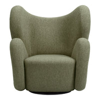 Textured green upholstered armchair with a unique, sculptural design and rounded contours.