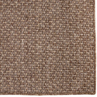 Brown woven rug with intricate geometric patterns and textured surface. Perfect for adding warmth to any room.