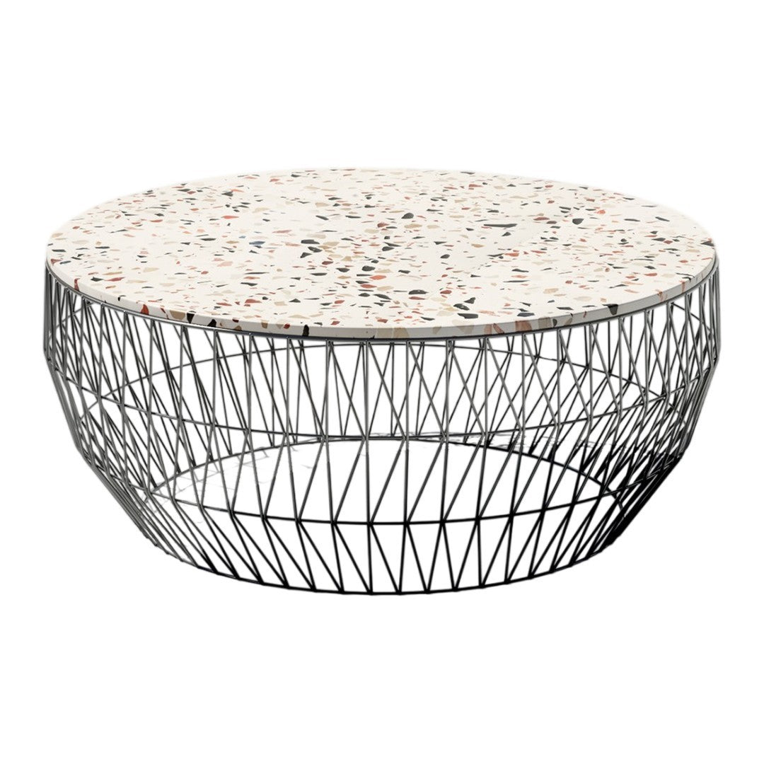 Round coffee table with a speckled white and black surface, featuring a geometric metal wire base.