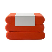 Stacked vibrant orange cushions with a contrasting white stripe, showcasing a modern, minimalistic design.