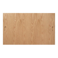 Light oak wood table surface with a smooth, natural grain pattern and two cut-out handles.