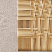 Natural woven texture in light beige tones with subtle wood accents, showcasing intricate patterns and craftsmanship.