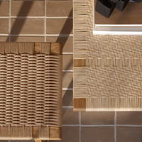 Natural beige and light brown woven patterns on wood and rattan surfaces, set on a neutral tiled background.