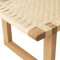 Natural beige woven pattern with light wood accents, showcasing a minimalist design.