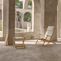 Light beige fabric on a natural wood frame, featuring a simple, elegant design with clean lines and minimal patterns.