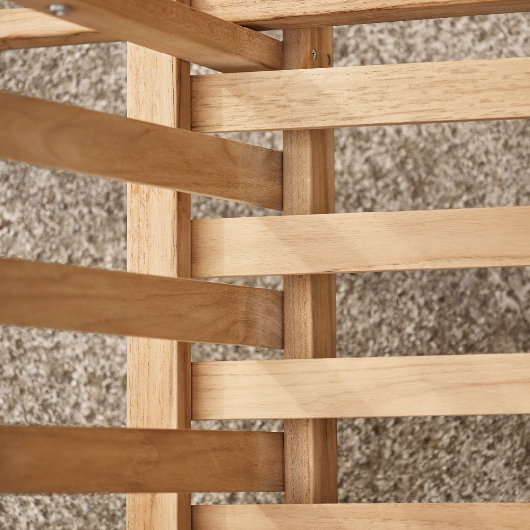 Close-up of light wood slats with a natural finish, arranged in a crisscross pattern over a soft, beige carpet.