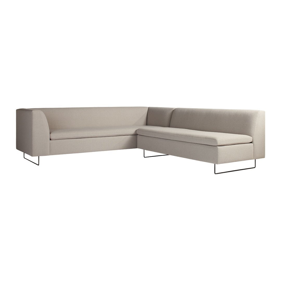 Light beige sectional sofa with a smooth, minimalist design and sleek metal legs. Ideal for modern interiors.