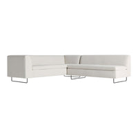 Cream and white sectional sofa with minimalistic black metal legs, featuring a textured fabric surface for modern appeal.