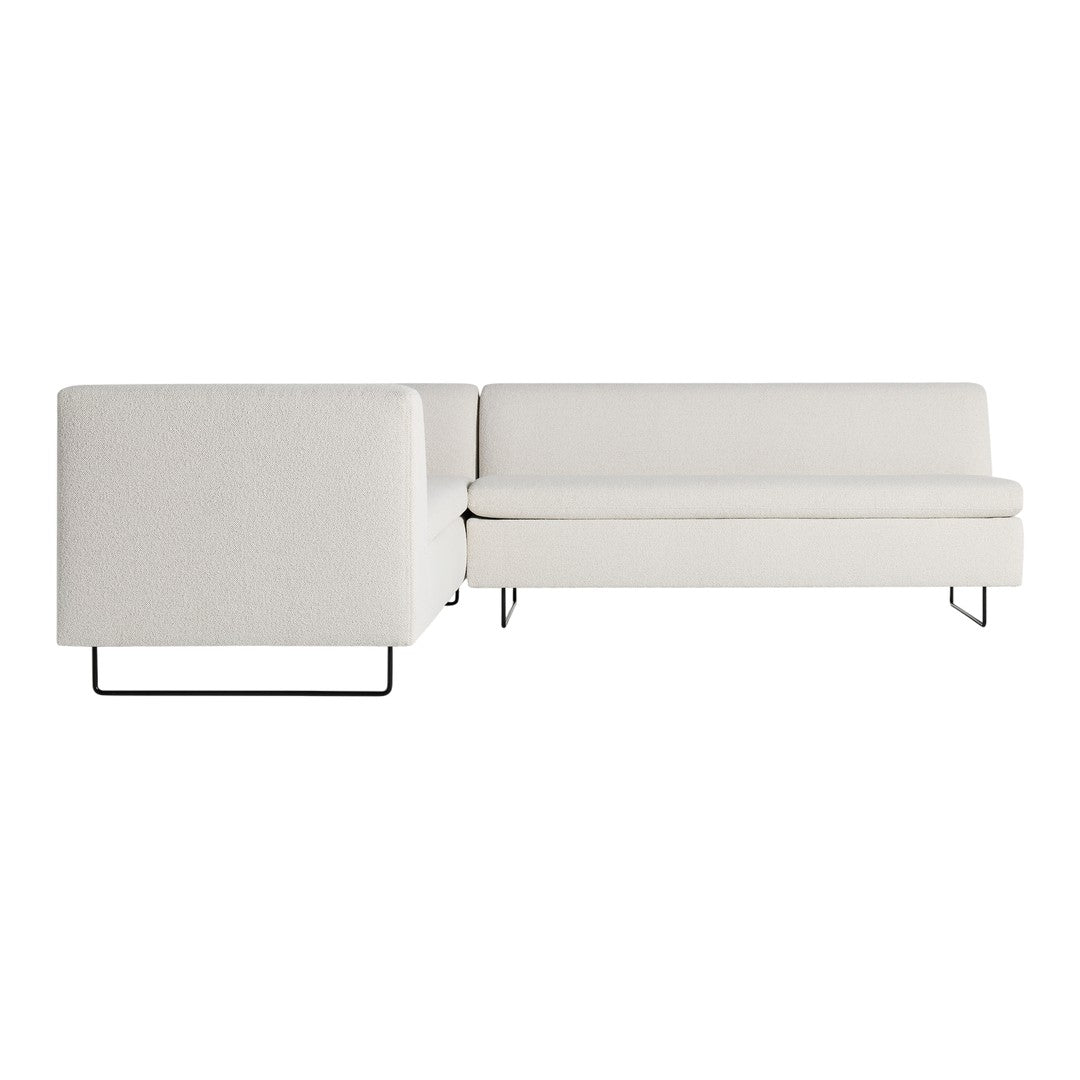 Modern white upholstery sectional sofa with subtle textured patterns and sleek black metal legs.