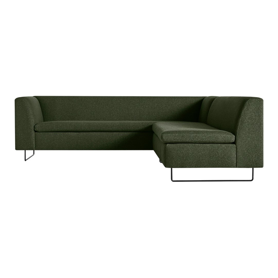 Modern green fabric sectional sofa with a minimalist design and sleek metal legs. Perfect for contemporary living spaces.