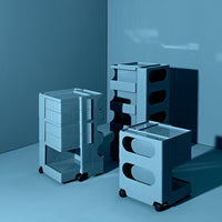 Blue storage carts with sleek designs and unique circular and rectangular cutouts, arranged on a matching blue background.