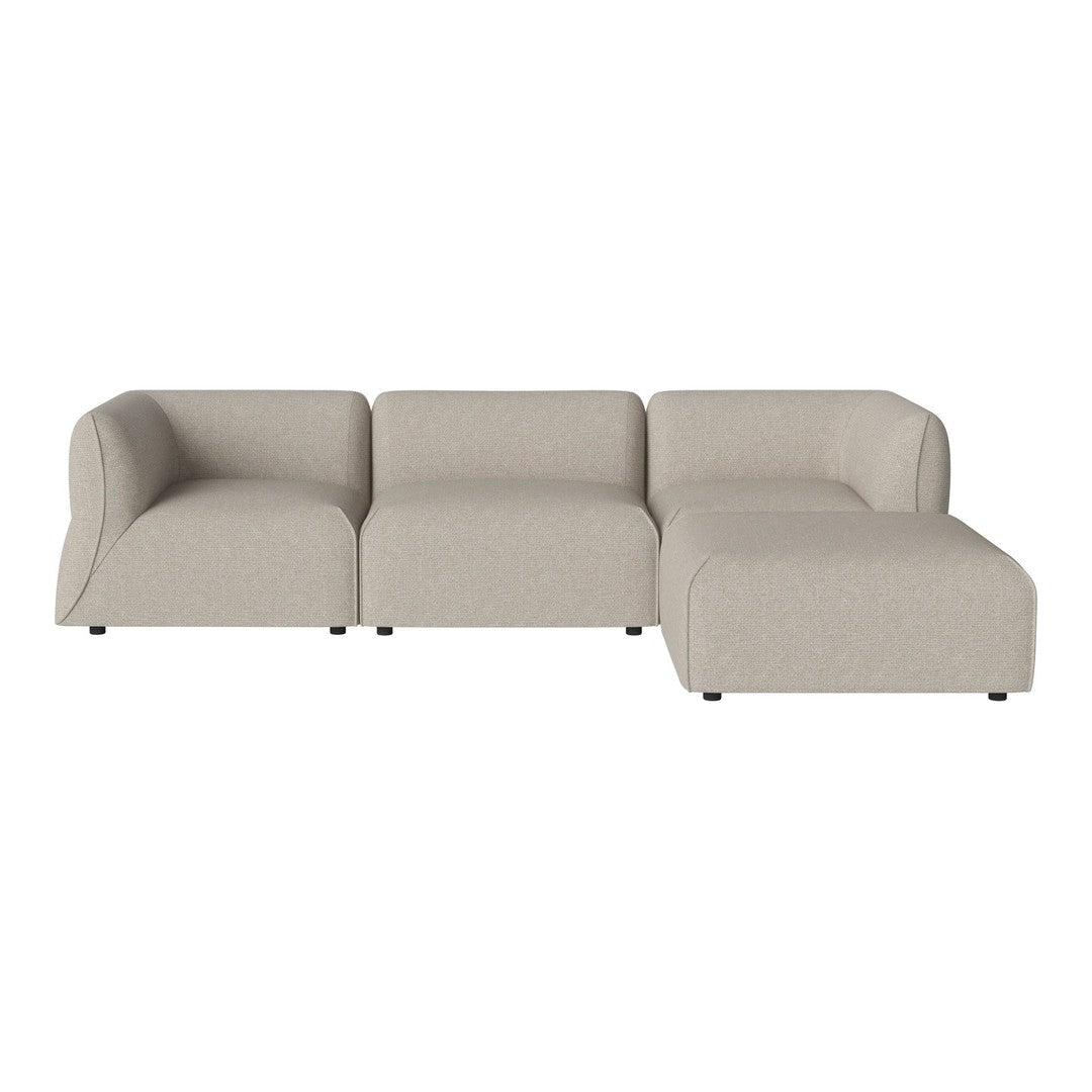 Light beige sectional sofa with smooth lines and contemporary design. Upholstered in a soft, textured fabric.