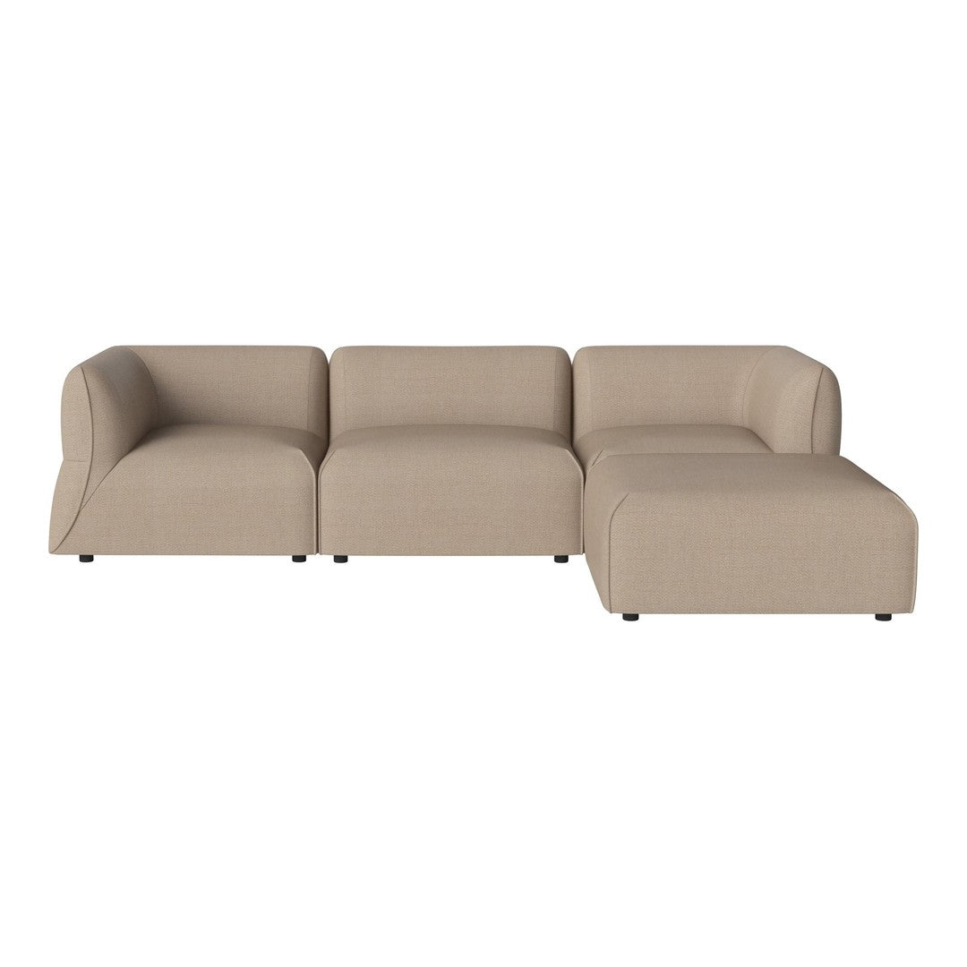 Beige modular sectional sofa with a smooth, minimalist design, featuring subtle textured fabric.
