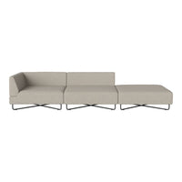Modern sectional sofa in soft beige fabric with a minimalist design and sleek metal legs, adding elegance to any space.
