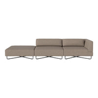 Contemporary sectional sofa in a soft taupe fabric with subtle texture, featuring sleek black metal legs.