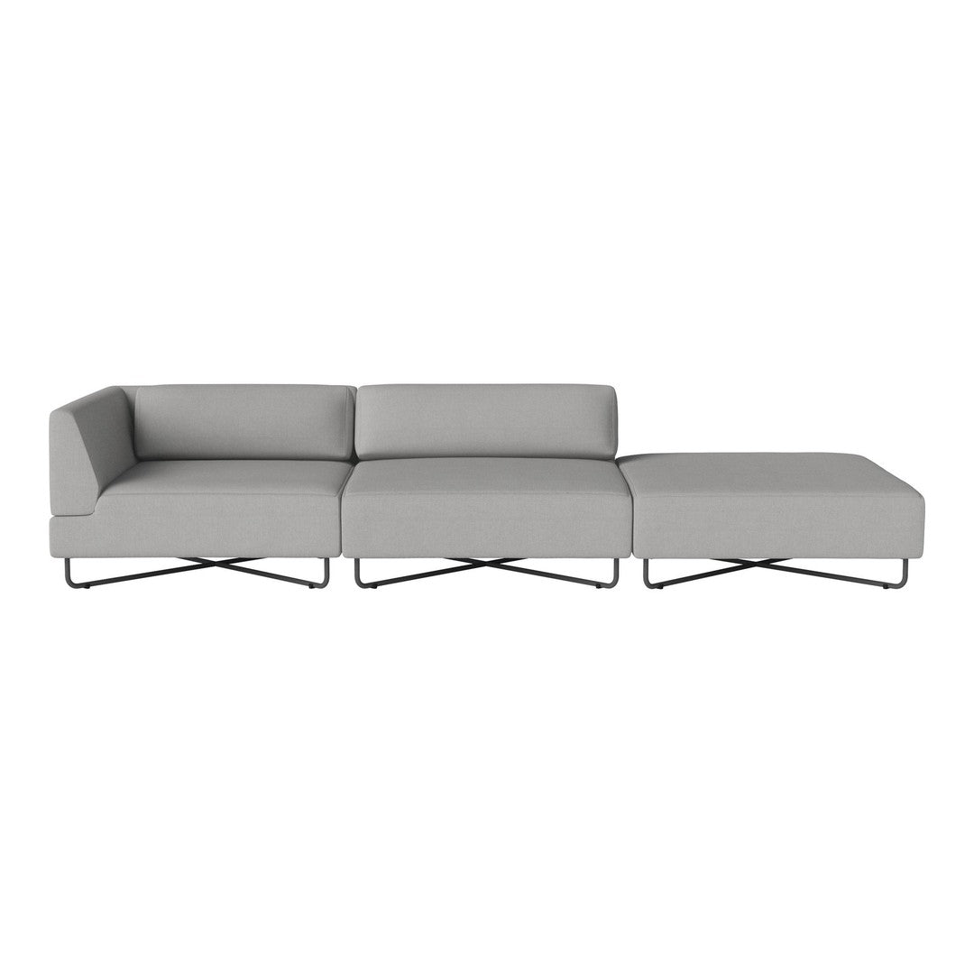 Gray sectional sofa with a modern design and clean lines, featuring smooth fabric and sleek metal legs.