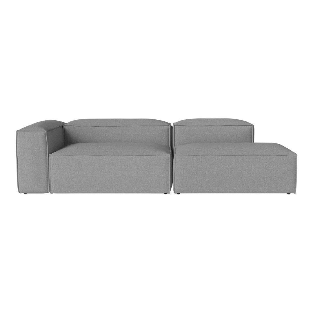 Gray modular sofa with a minimalist design and smooth fabric texture, perfect for modern living spaces.