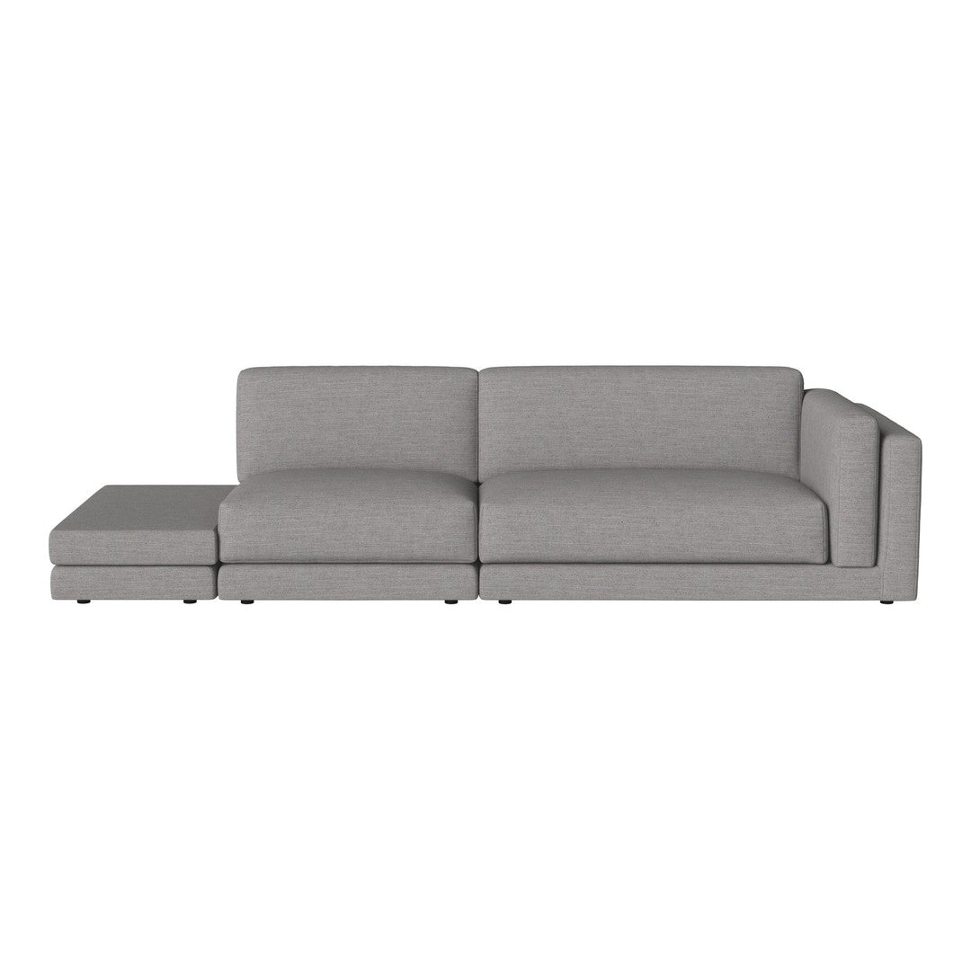Modern gray sectional sofa with clean lines and a minimalist design, featuring soft fabric upholstery.