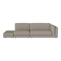 Modern beige sectional sofa with clean lines and smooth fabric, perfect for minimalist interiors.