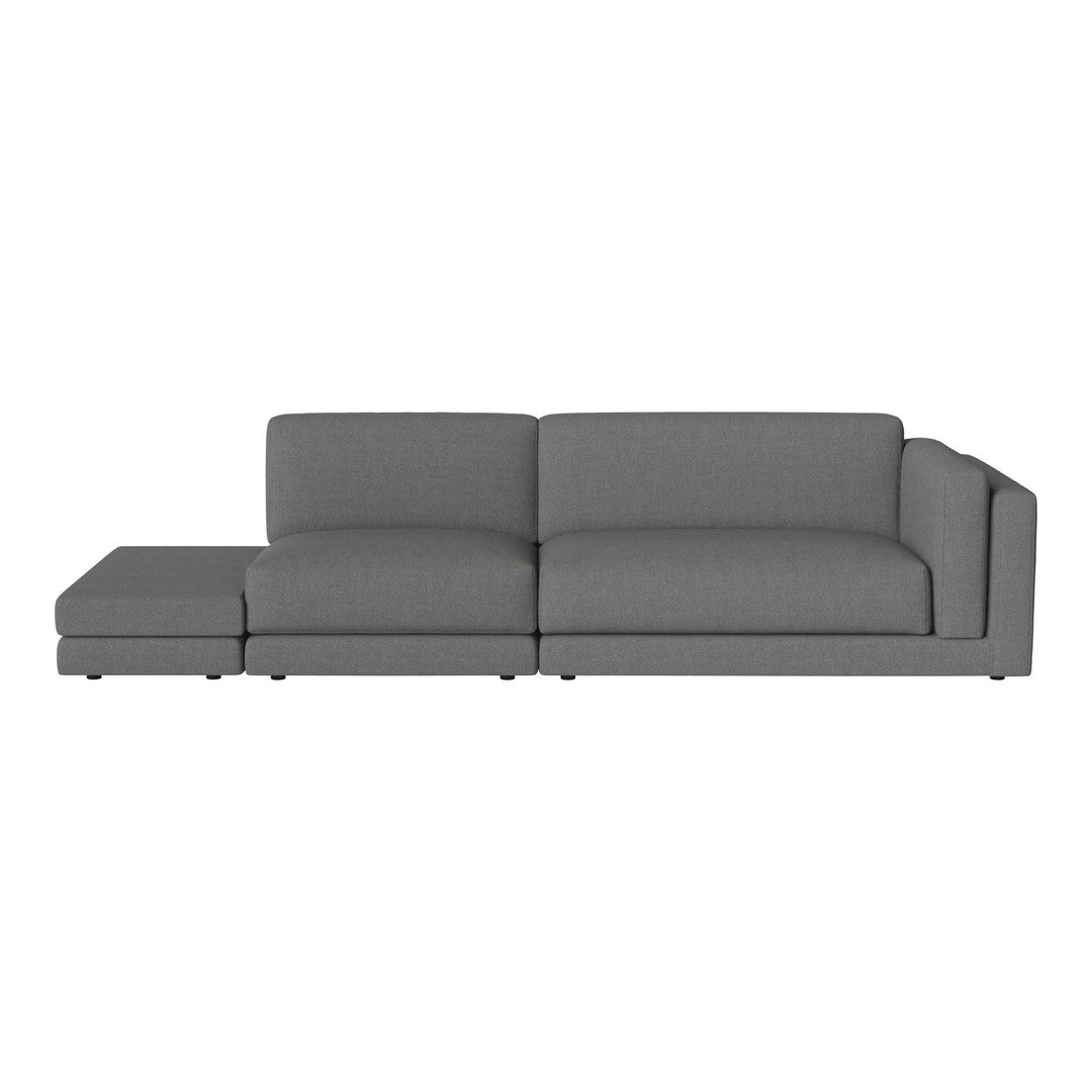 Gray sectional sofa with a modern, minimalist design and smooth fabric pattern. Perfect for stylish living spaces.
