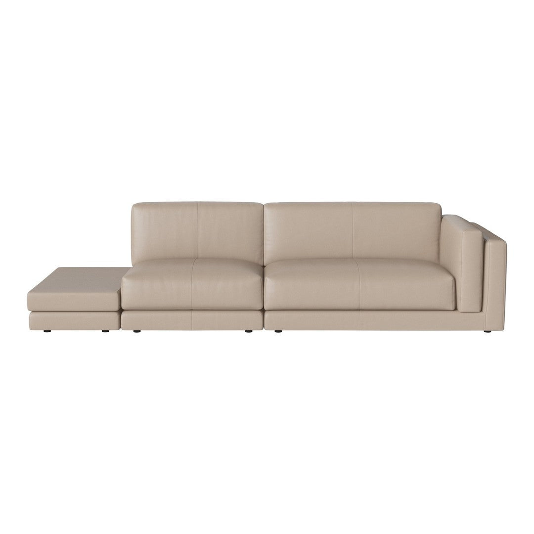 Beige leather sectional sofa with smooth surfaces and minimalist design. Perfect for modern living spaces.