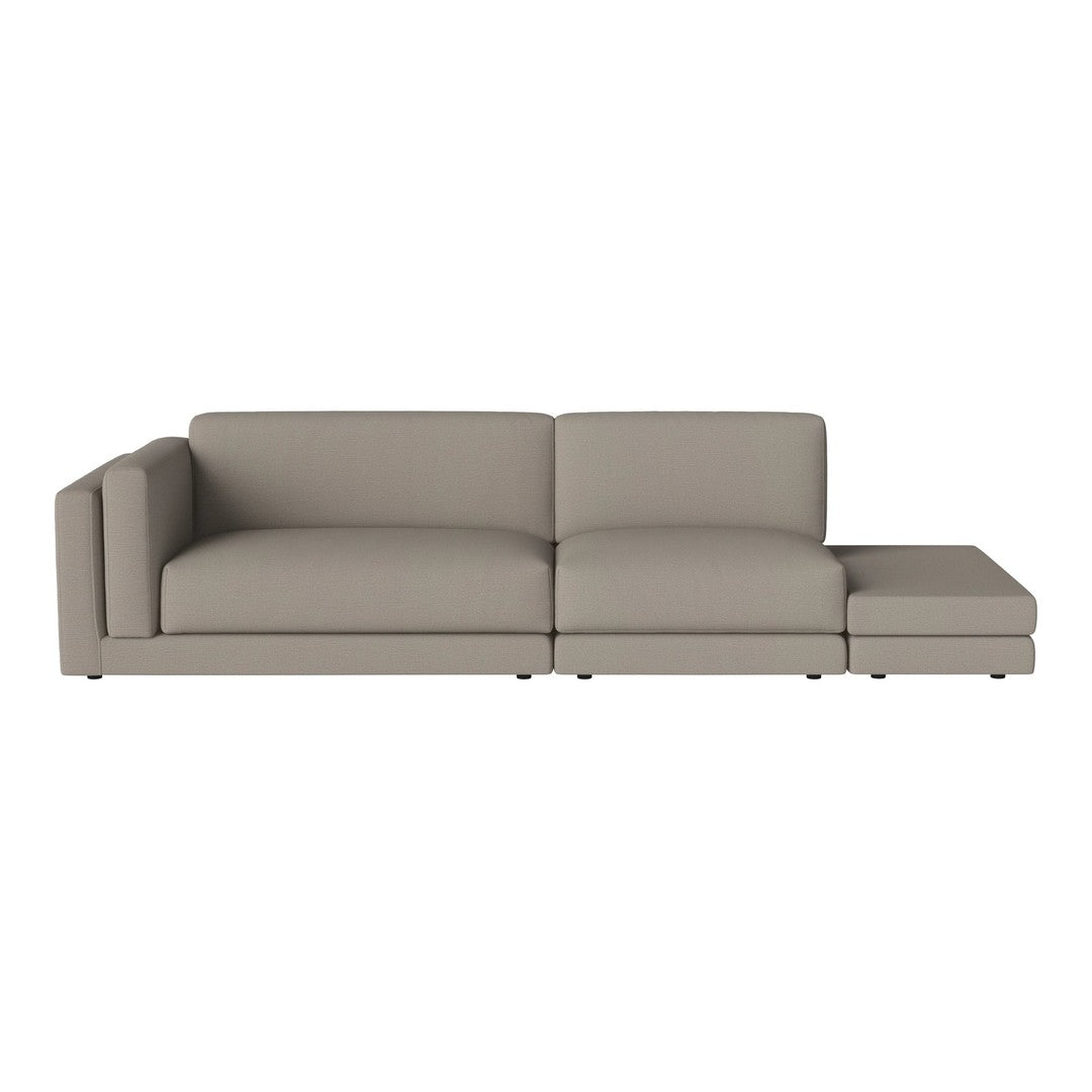 Modern light gray sectional sofa with clean lines and smooth upholstery, perfect for contemporary living spaces.