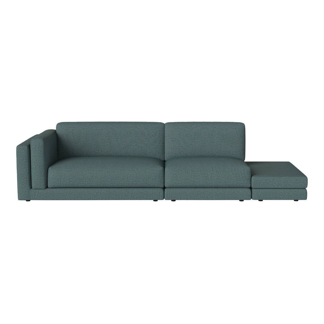 Modern teal sofa with a sleek design, featuring a solid color and minimalist style for contemporary decor.