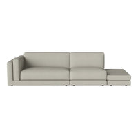 Light gray sectional sofa with a minimalist design and smooth, solid fabric texture.