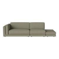 Olive green sectional sofa with a smooth, minimalist design and subtle textured fabric. Perfect for modern decor.