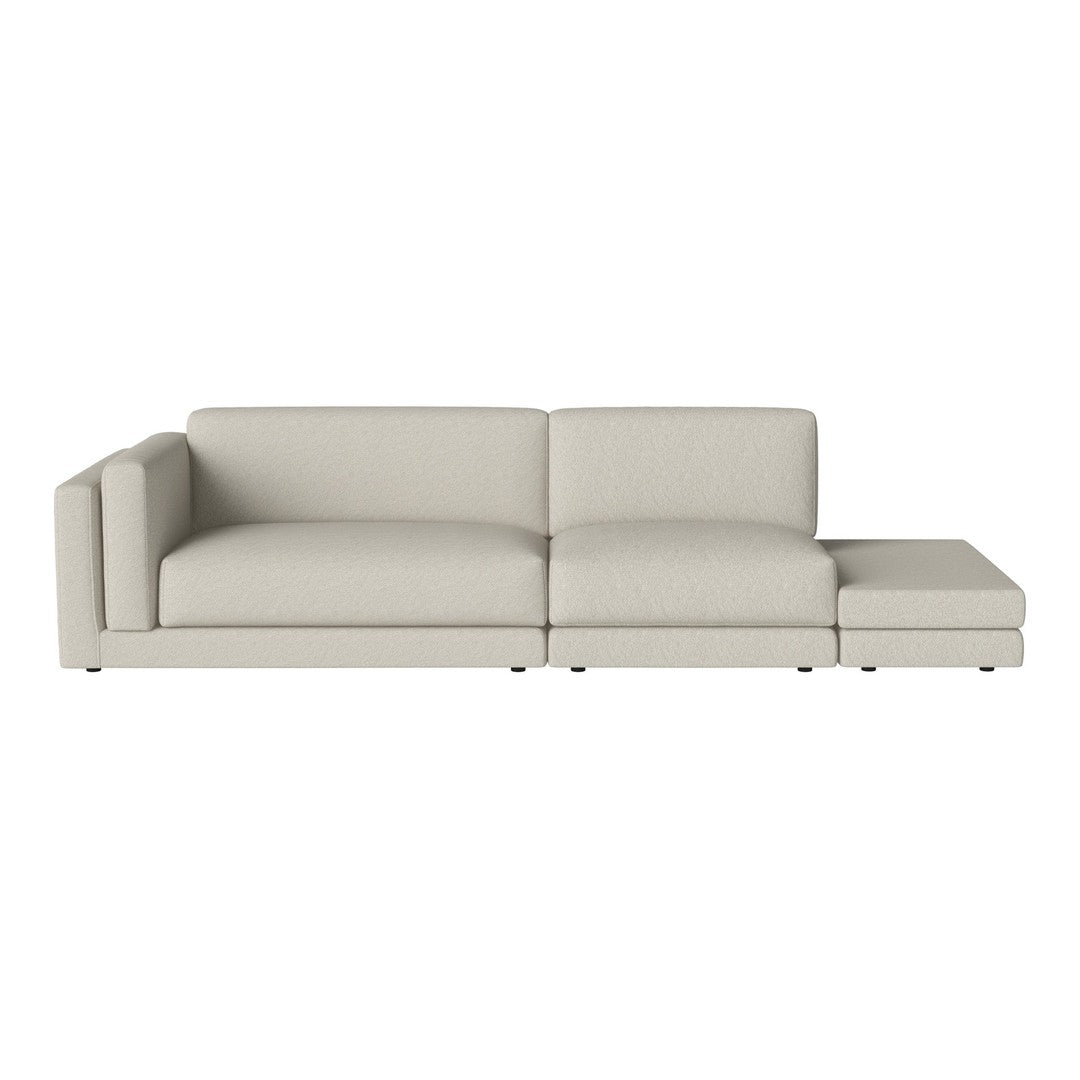 Light beige sectional sofa with a minimalist design and smooth fabric texture, perfect for modern living spaces.