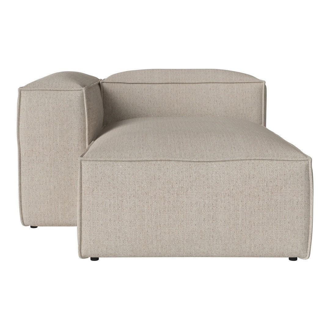 Beige textured chaise lounge with a smooth, minimalist design and subtle, neutral color palette.