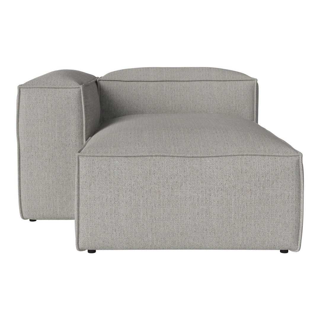 Light grey modular chaise lounge with a smooth, textured fabric finish. Modern, minimalist design.