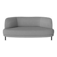 Grey curved sofa with a smooth, modern design and subtle texture for a minimalist decor.