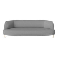 Gray curved sofa with a smooth, modern fabric and light wood legs, ideal for minimalist decor.