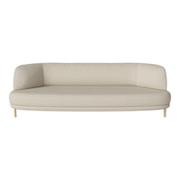 Beige modern curved sofa with minimalist design and smooth upholstery, featuring light wooden legs.