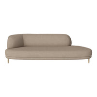 Beige curved sofa with a smooth fabric texture and minimalist design, featuring a natural wooden base.