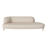 Beige curved sofa with textured fabric and minimalist design, featuring smooth lines and light wood legs.