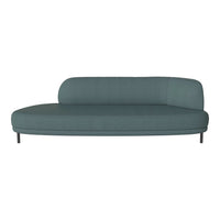 Teal curved sofa with minimalist design and smooth fabric texture, perfect for modern interiors.